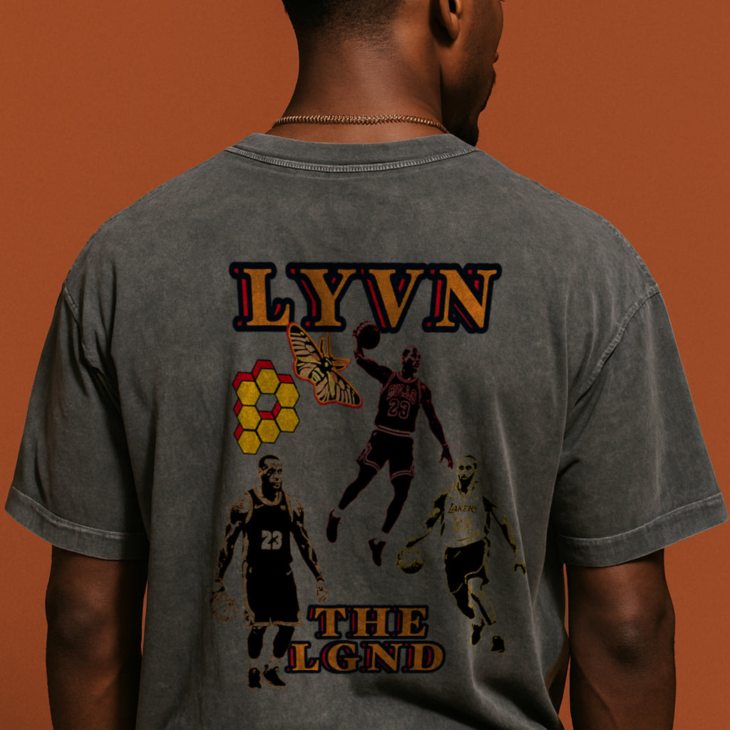 Person wearing a gray t-shirt with graphics and text on the back against an orange background