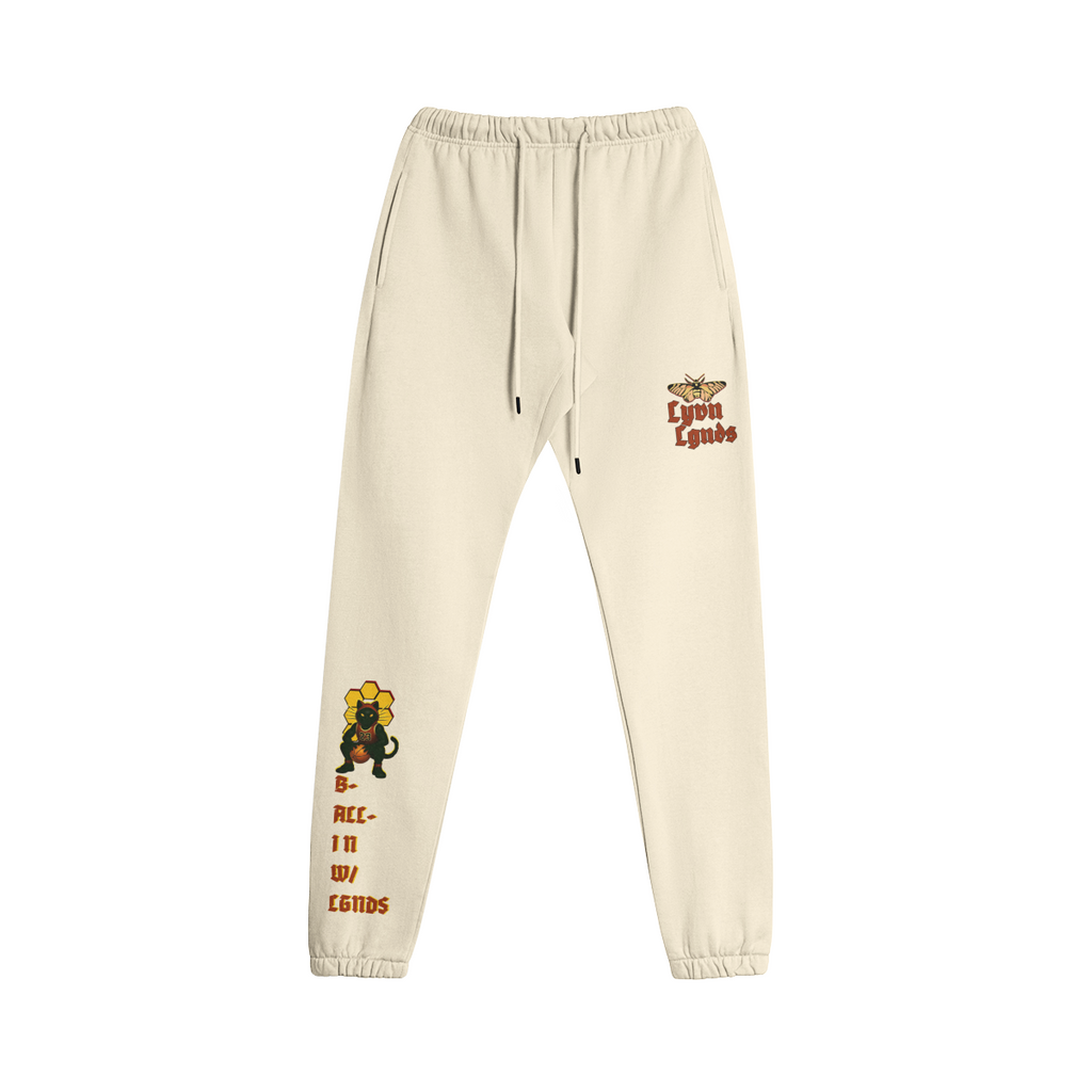 Beige sweatpants with graphics and text on a white background